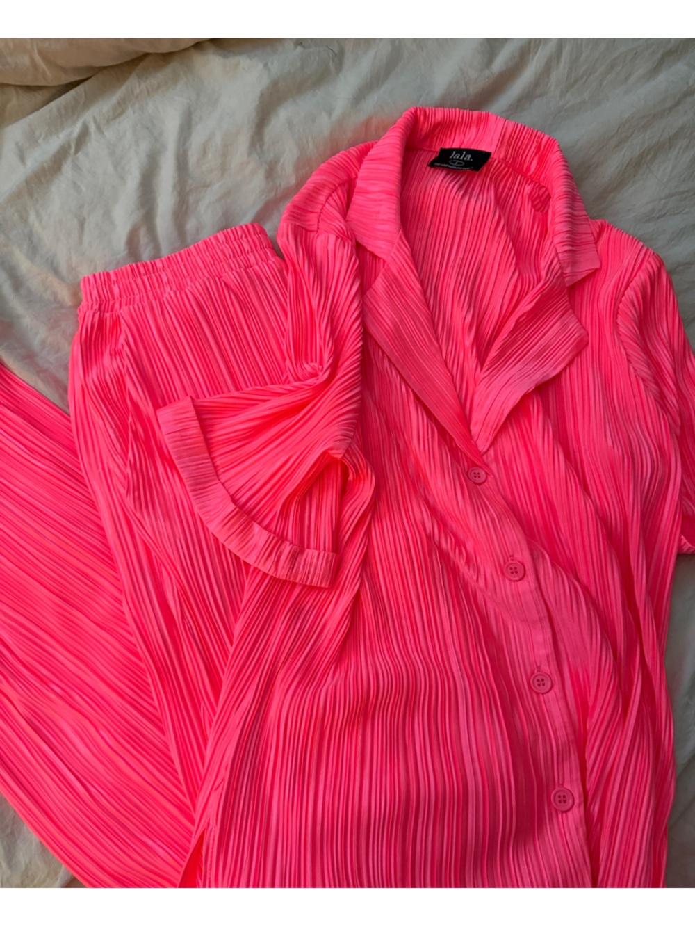 Dressed in la la neon pink plisse set